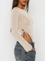 Long sleeve beige ruched top with adjustable side tie detail