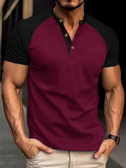 Burgundy raglan henley polo shirt with black sleeves and gold buttons