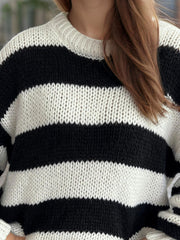Chunky knit jumper with black and white horizontal stripes and crew neck.