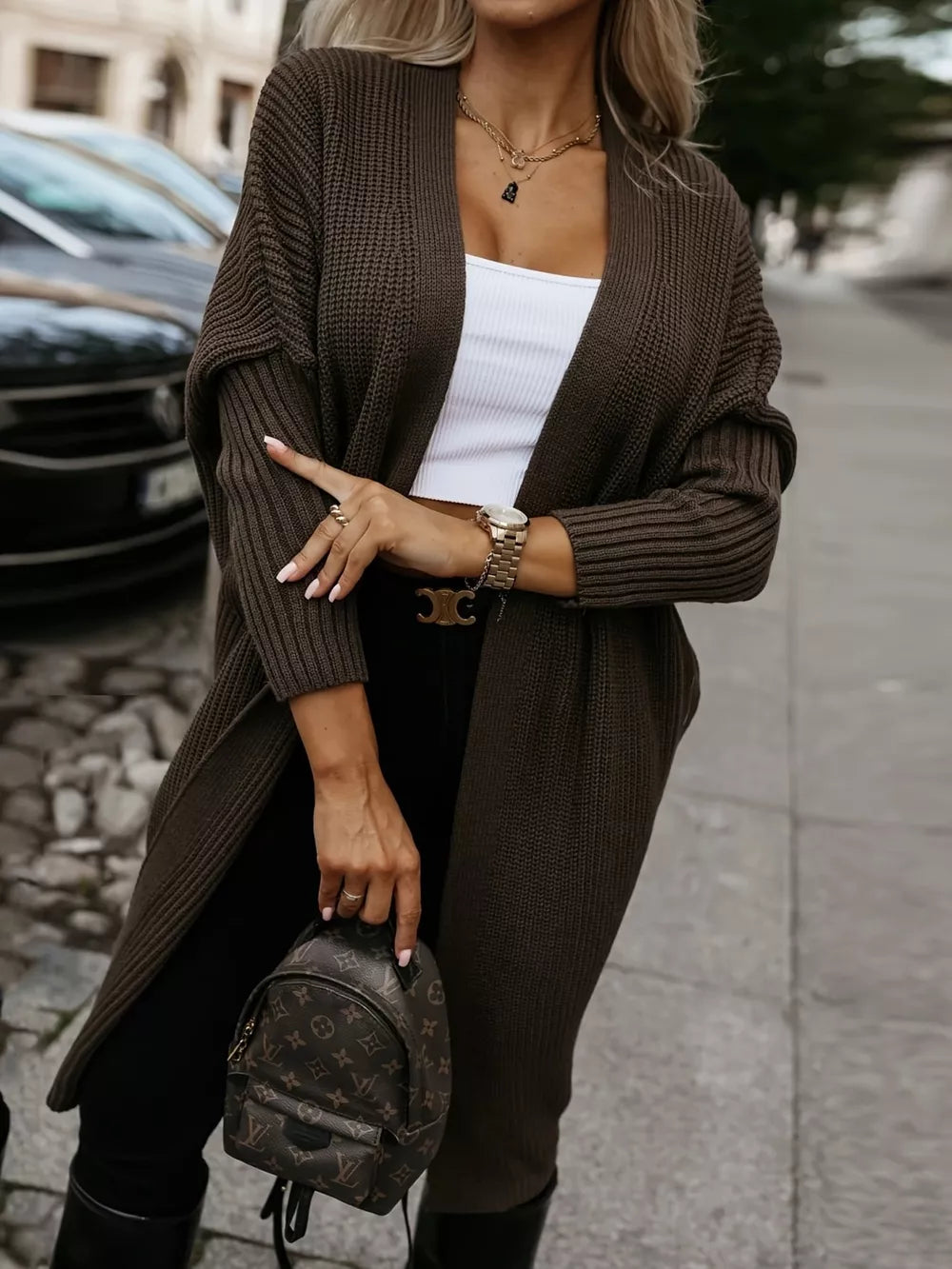 Brown ribbed texture longline knit cardigan with open front and relaxed fit.