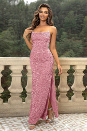 Sequin cami gown in strawberry with spaghetti straps and a high slit.