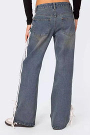 Side stripe wide-leg denim trousers in light blue with tie detail at hem.