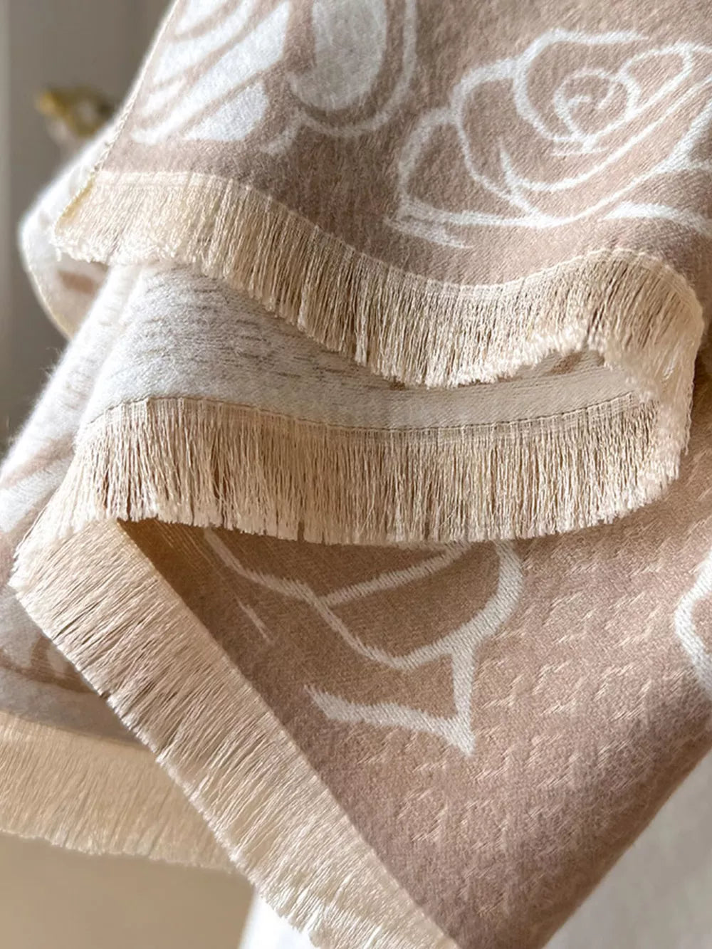 Elegant floral pattern scarf in khaki with fringe detail.