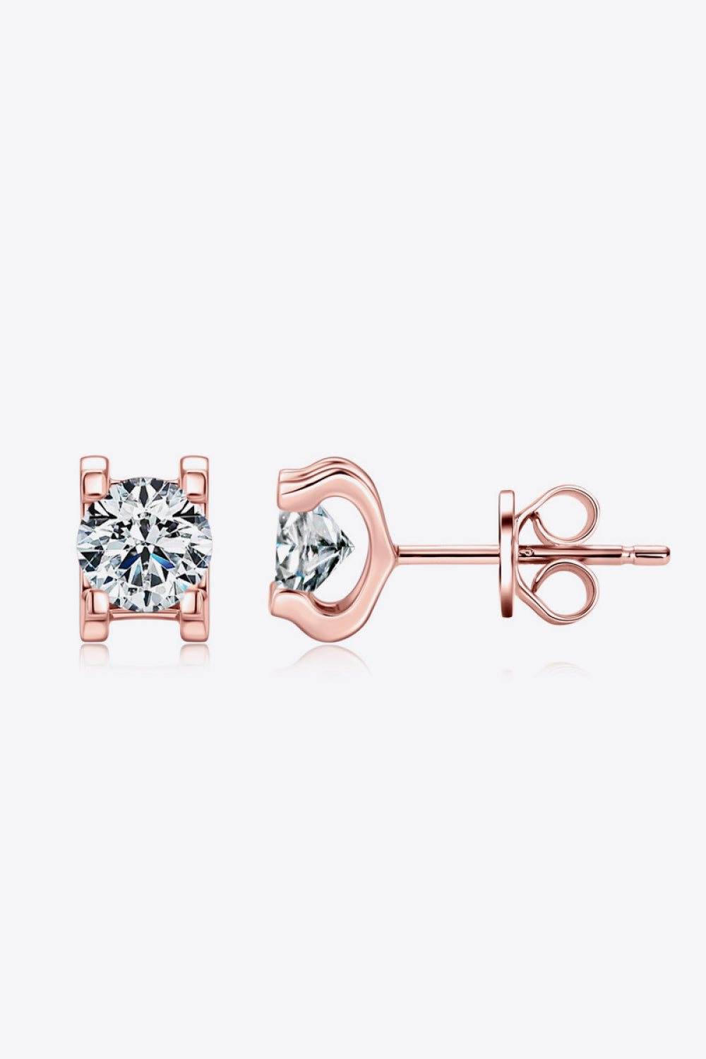 Rose gold moissanite solitaire stud earrings with clear round-cut stones.