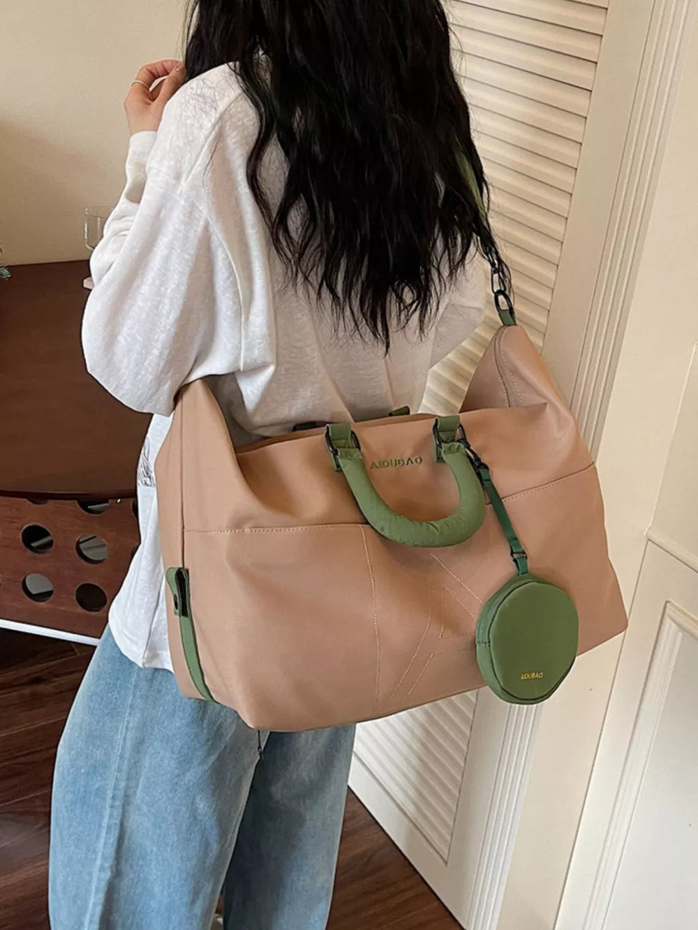 Two-tone nylon duffle bag in camel with green accents and detachable pouch