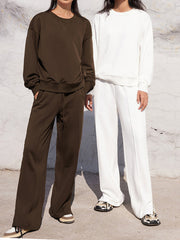 Brown and white seamed sweatshirt and wide-leg lounge pants set with drawstring waist.
