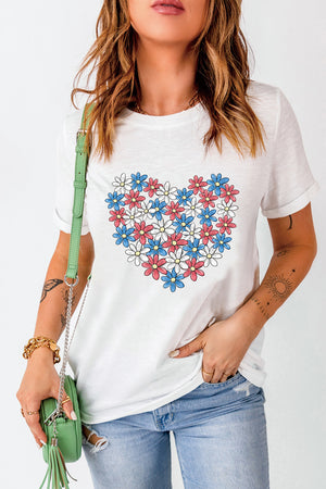 White t-shirt with a heart graphic made of red, white, and blue flowers.