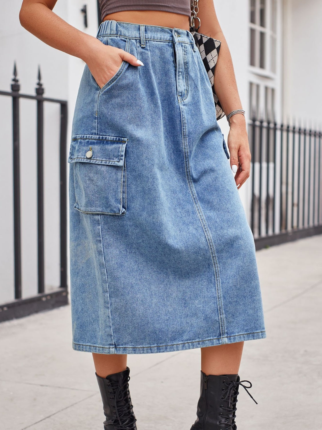 Light wash denim midi skirt with cargo pocket and front slit