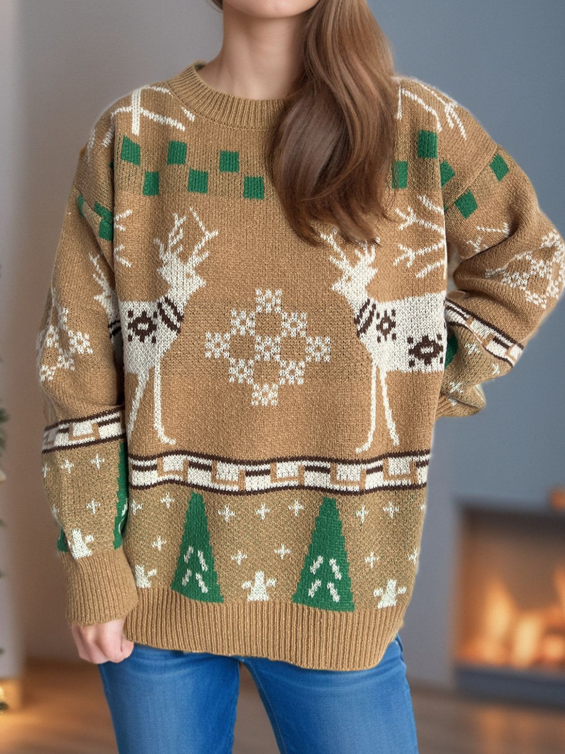 Tan acrylic knit sweater with reindeer, snowflake, and Christmas tree motifs.