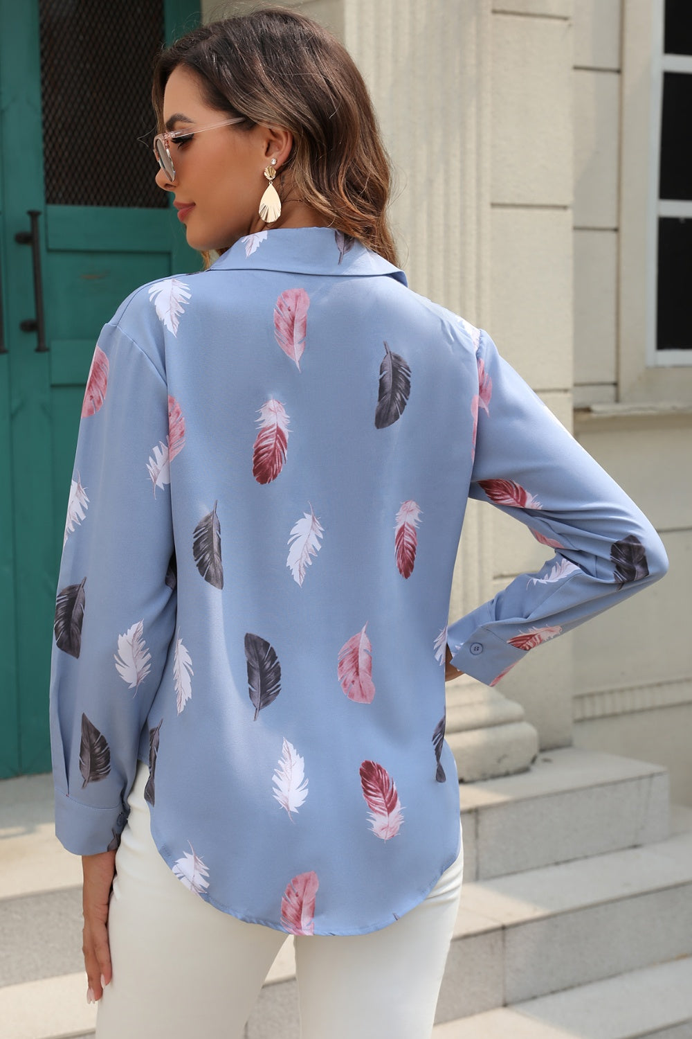 Light blue feather print button-down shirt with a silk-touch feel.