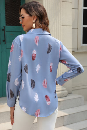 Light blue feather print button-down shirt with a silk-touch feel.