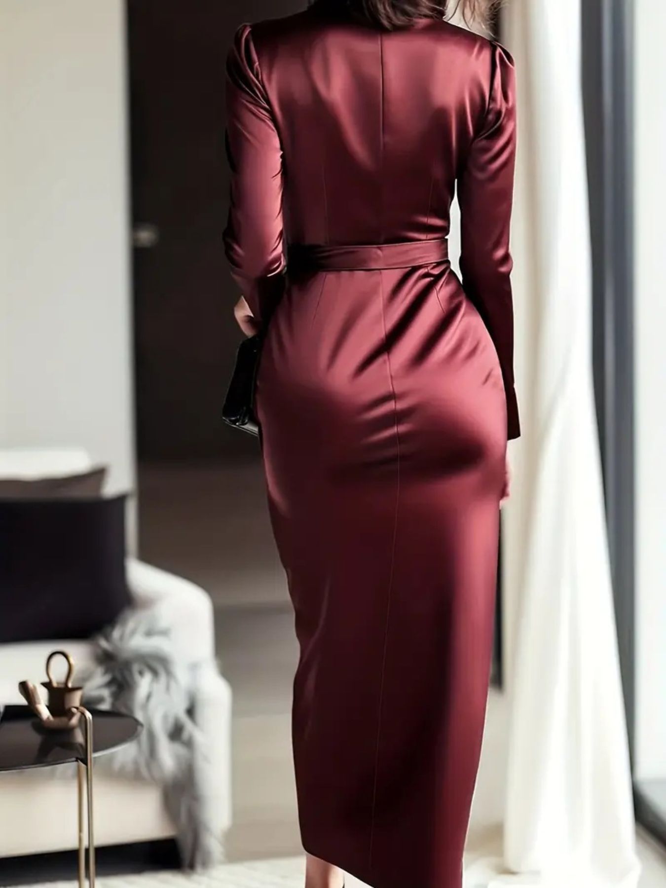 Burgundy satin maternity dress with tie waist and long sleeves.