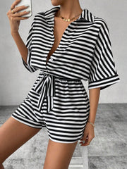 Black and white striped shirt romper with self-tie belt and button front.