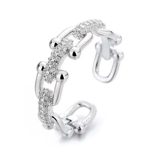 Open chain-link ring with pave zircon details in white gold color