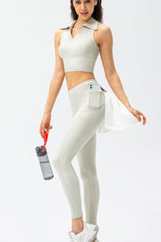 Cream athletic leggings with utility pockets, phone pocket, and towel detail.