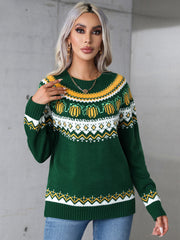 Dark green acrylic crewneck sweater with autumnal Fair Isle pattern and pumpkin motifs.