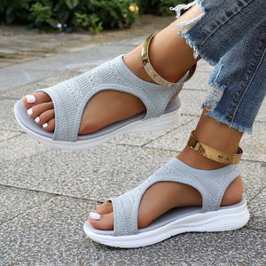 Light gray open-toe platform sandals with knit uppers and white soles.