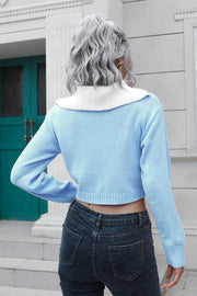 Light blue acrylic cropped sweater with white collar and zip detail