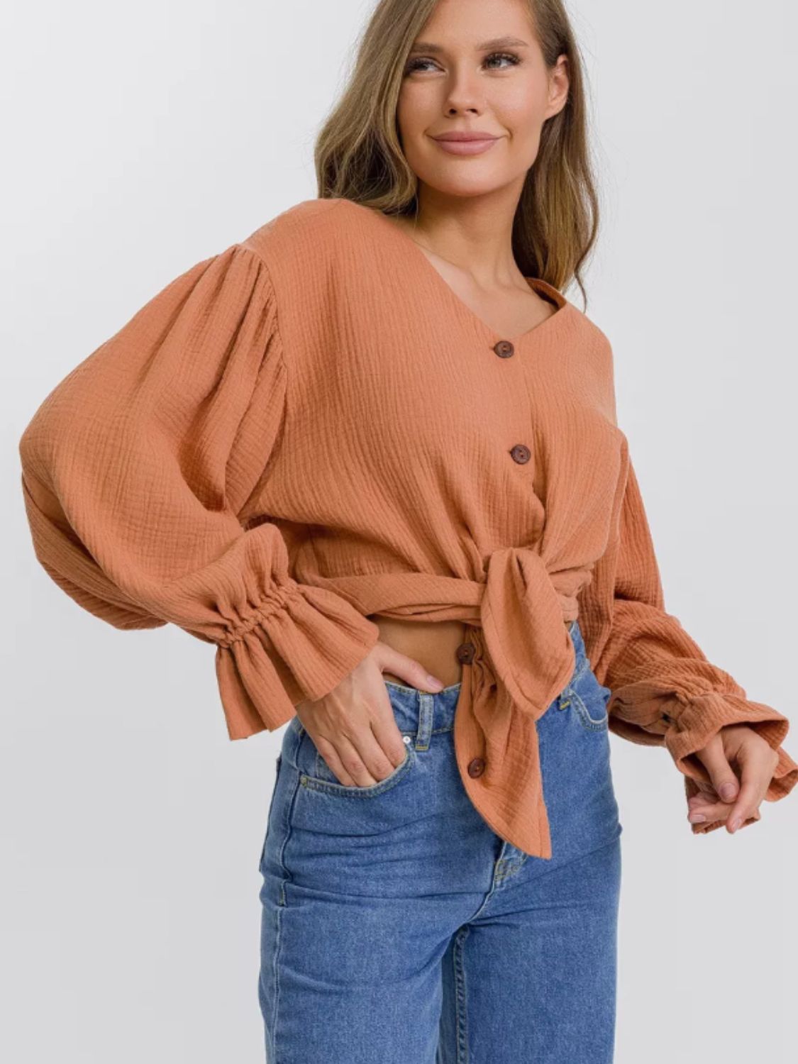 Ochre textured puff sleeve blouse with ruffled cuffs and tie front