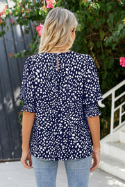 Dark Blue spot print blouse with shirred short sleeves and keyhole back detail.