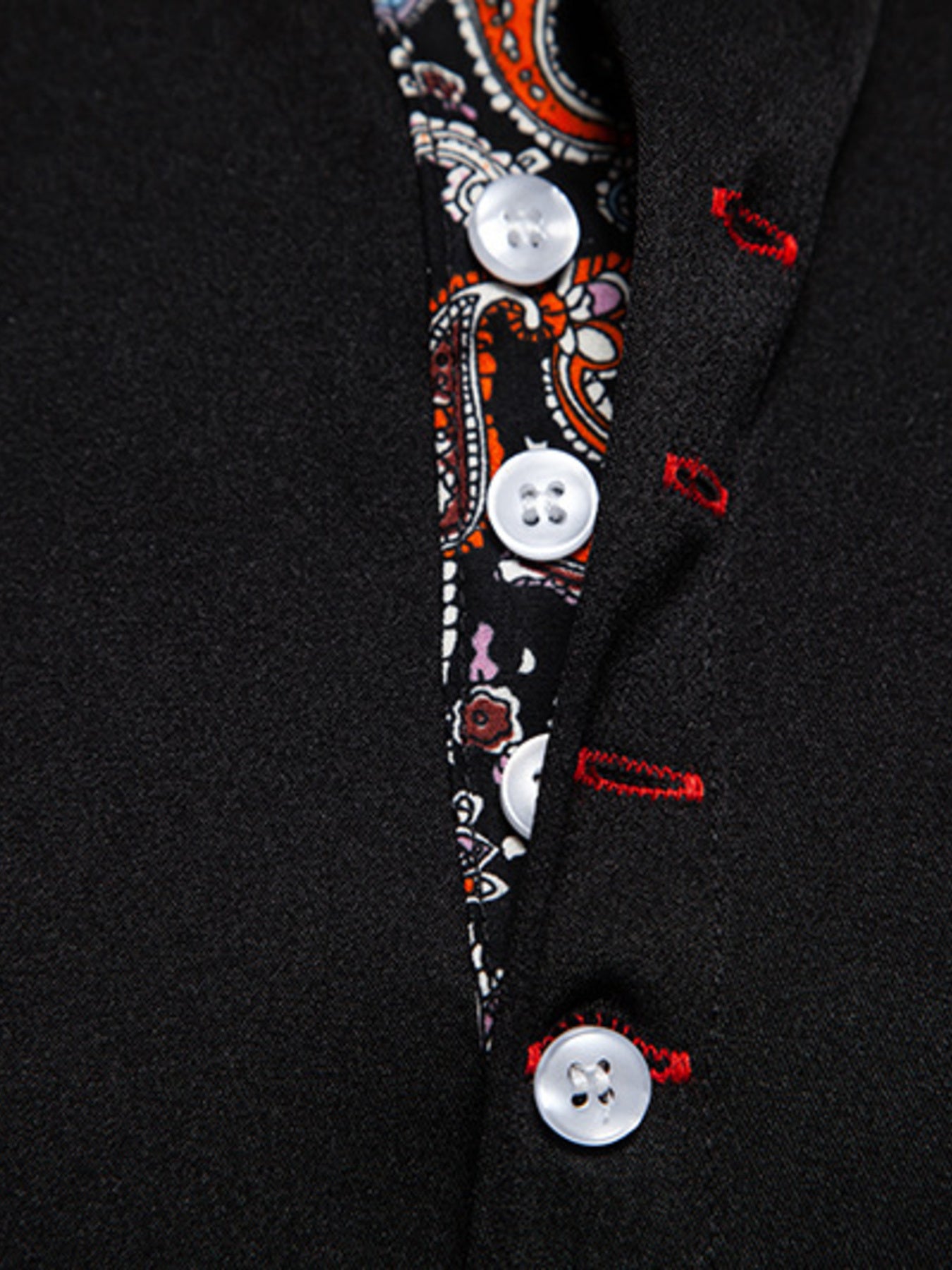 Black short sleeve shirt with paisley trim detail and white buttons