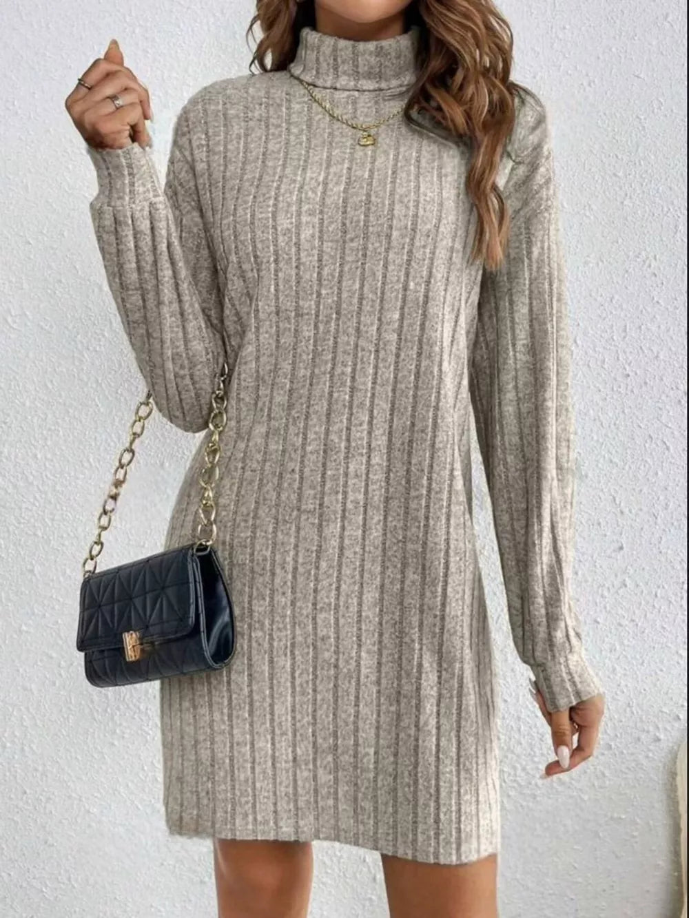 Light gray ribbed turtleneck mini dress with long sleeves and a casual fit.