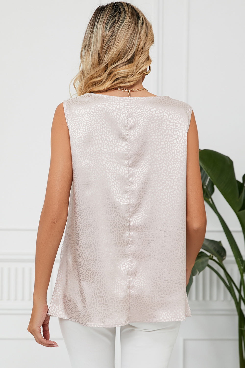 Beige jacquard tank top with a subtle animal print pattern and a drape neckline.
