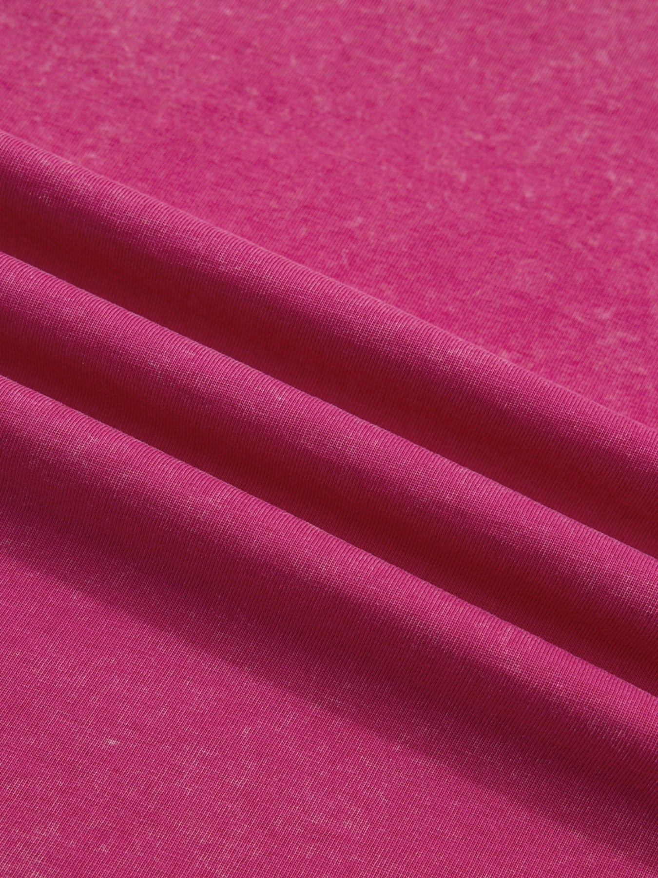 Pink cotton t-shirt fabric with a subtle heathered texture.