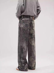 Dark gray wide-leg jeans with distressed details and a relaxed fit.