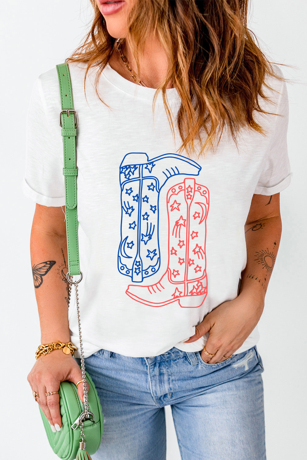 White t-shirt with a red and blue outline graphic of cowboy boots with stars and stripes pattern.