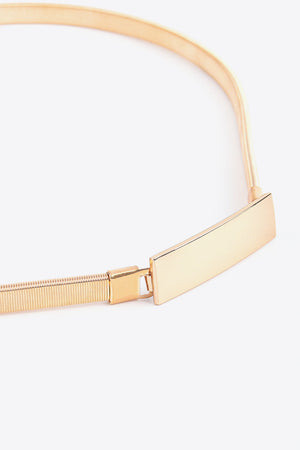 Slimline gold-tone metal waist belt with a rectangular buckle detail.