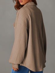 Camel textured oversized button-down shacket with a collared neckline and long sleeves.