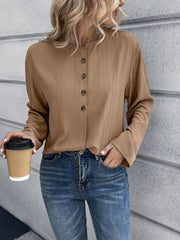 Camel mandarin collar button-down blouse with subtle vertical texture and button detail.