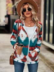 Aztec print zip-up hooded jacket in teal, rust, and white with a white lining and drawstring hood.