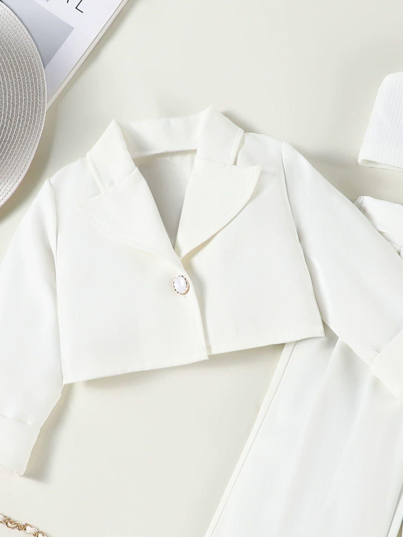 Toddler white cropped blazer with pearl button detail, part of a three-piece set.