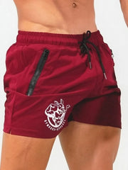 Deep Red training shorts with drawstring, zip pockets, and logo detail.