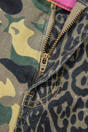 Contrast patchwork jeans with camo and leopard print, featuring a zip fly and contrast stitching.
