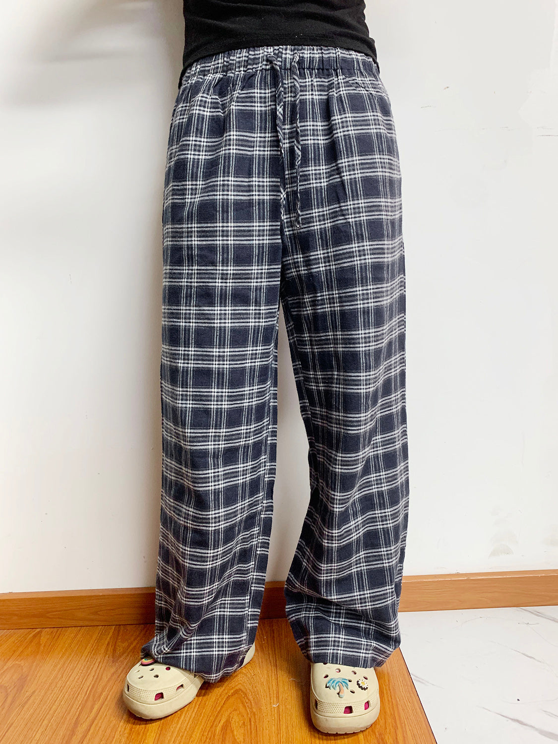 Relaxed plaid drawstring palazzo pants in dusty blue with a wide leg and casual fit.