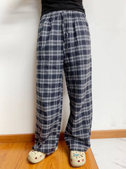 Relaxed plaid drawstring palazzo pants in dusty blue with a wide leg and casual fit.