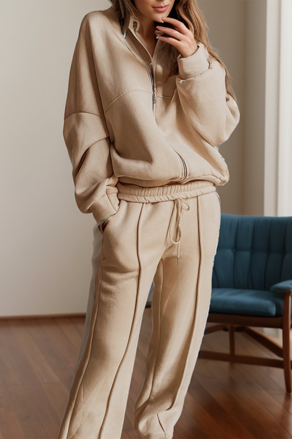 Tan seamed jogger set with zip-up bomber jacket and drawstring pants.