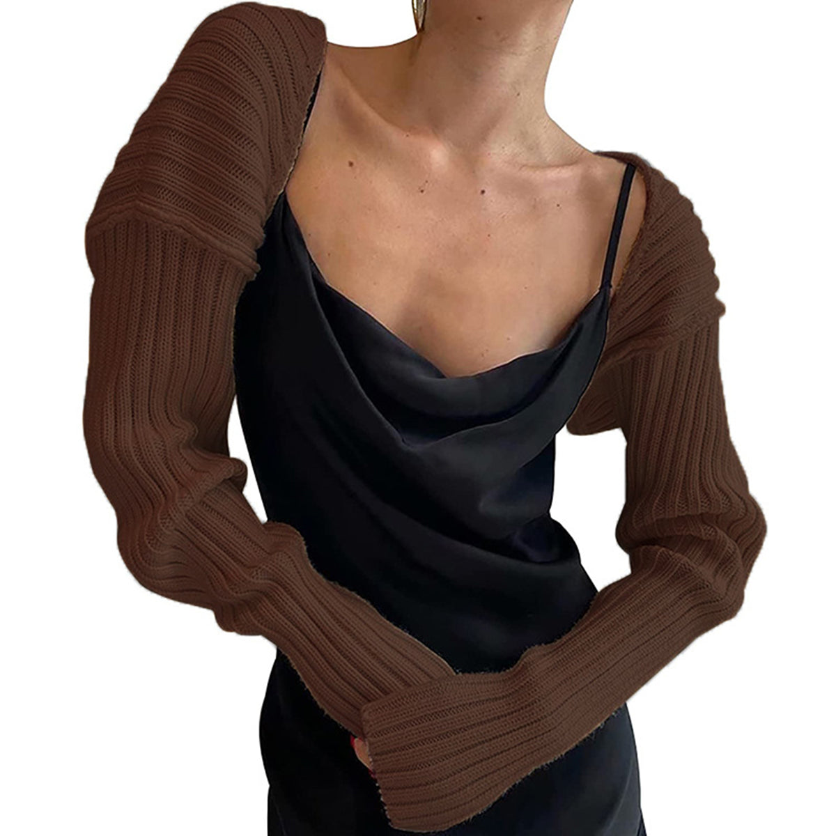 Brown ribbed knit shrug with extended sleeves worn over a black slip dress
