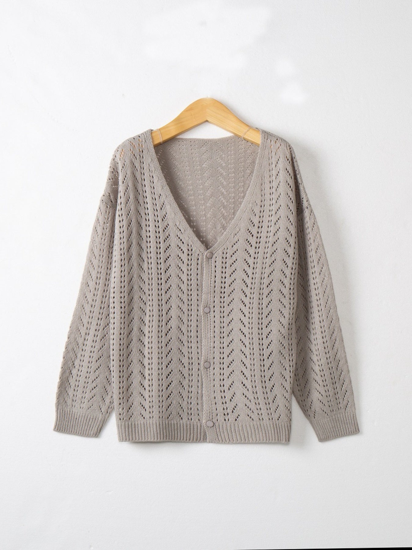 Gray chevron knit lightweight cardigan with V-neck and button front.