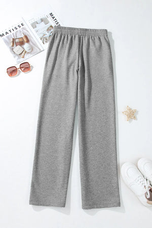 Relaxed-fit grey lounge joggers with elastic waistband and drawstring detail.