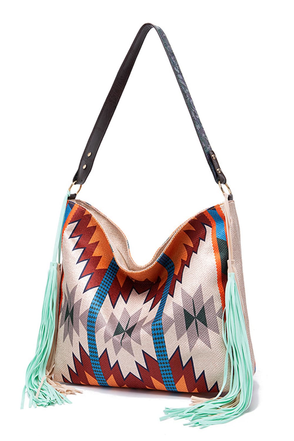 Southwestern fringe hobo bag with geometric pattern and mint green tassels.