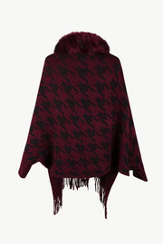 Burgundy houndstooth poncho with faux fur collar and fringe trim
