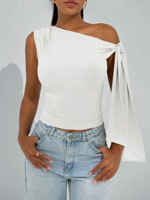 White asymmetrical tie detail blouse with one sleeve and cropped length.