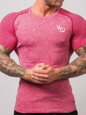 Performance raglan tee in strawberry heather with white logo and textured sleeves.