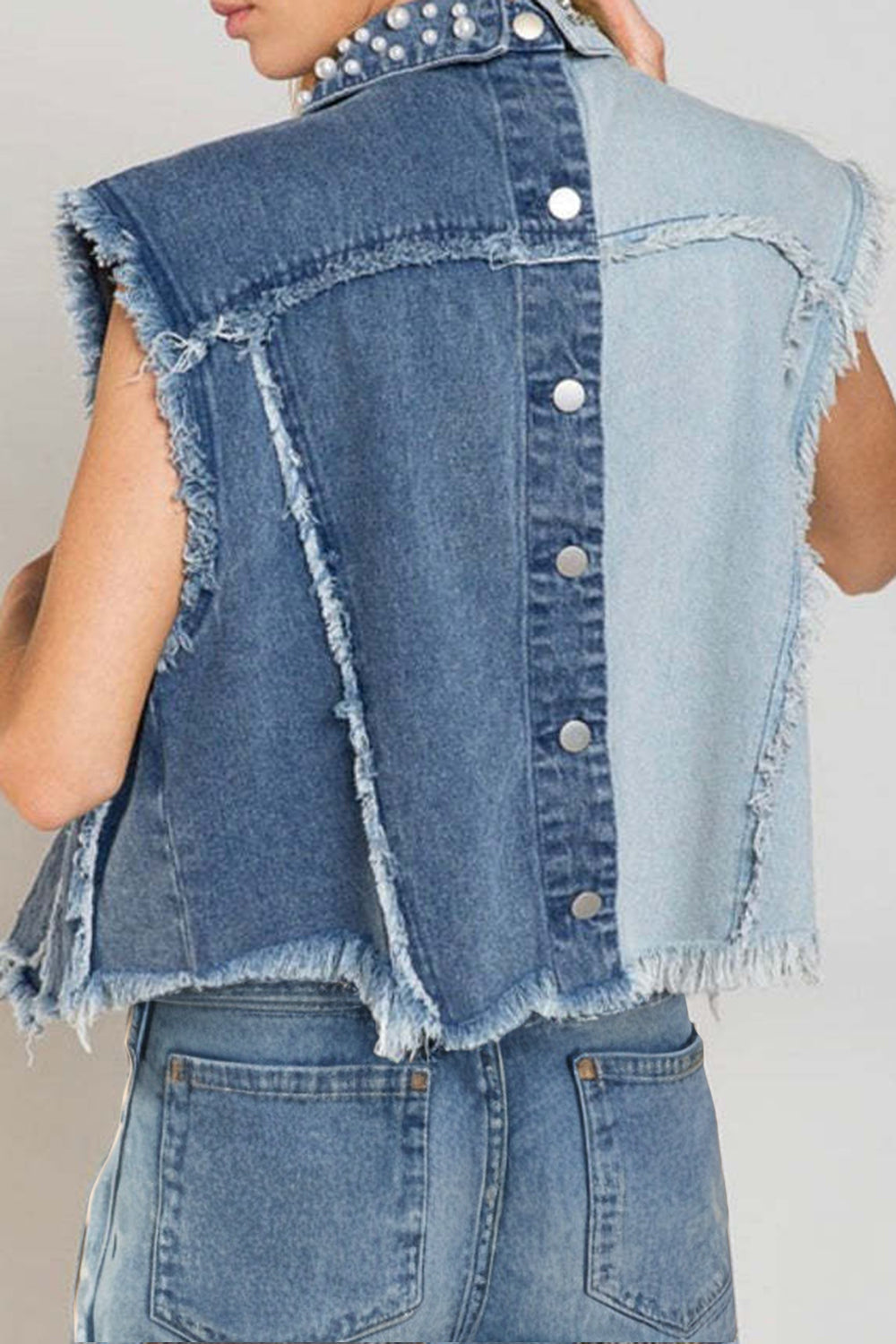 Two-tone denim vest with pearl embellishments and frayed hem