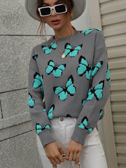 Gray knit crewneck sweater with allover turquoise butterfly motif.