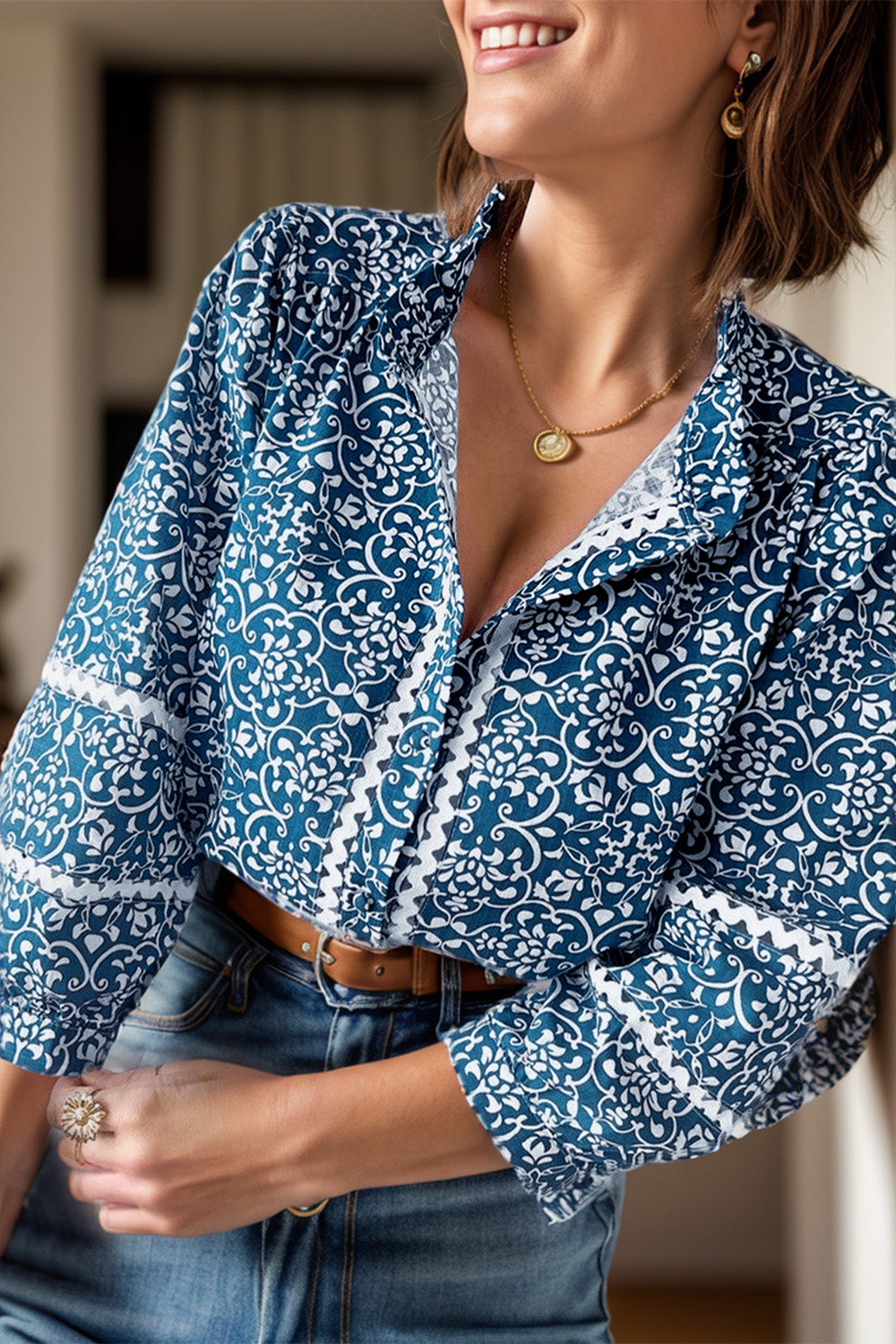 Peacock blue medallion print poet blouse with ruffled neckline and cuffs, 100% polyester